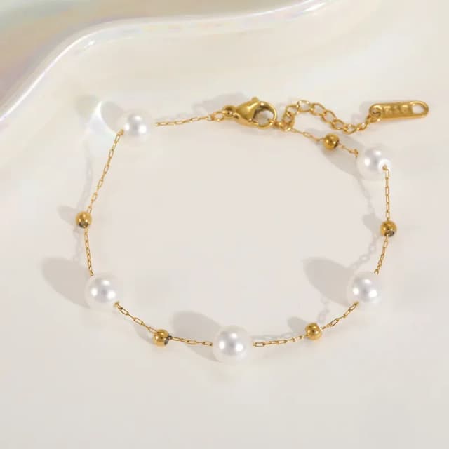 DUNA - Pulsera de Acero Titanio bañado en oro de 18K y Perlas Artificiales